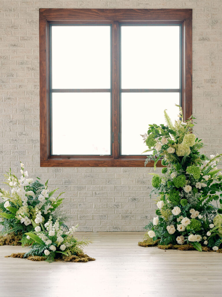 A lush green floral installation for a wedding ceremony at a Colorado wedding venue in Boulder.