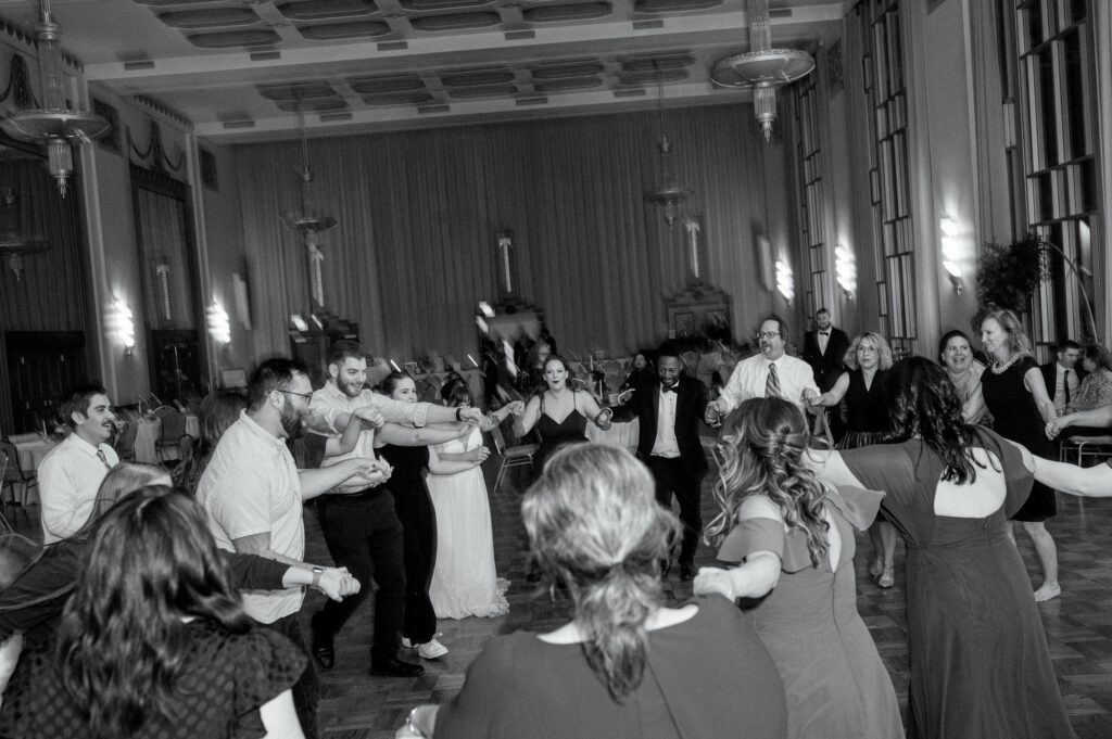 A bride and groom dance with their guests at their wedding reception in downtown OKC.